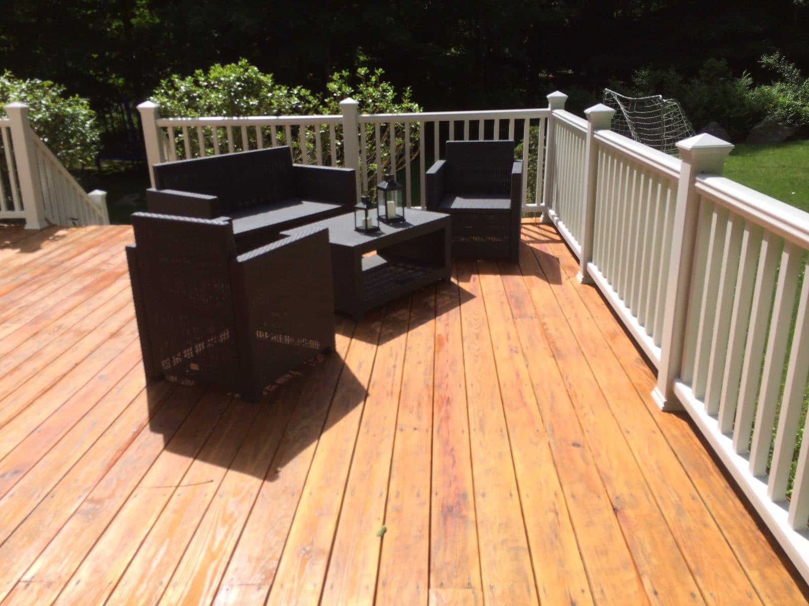 Stained wood deck with furniture