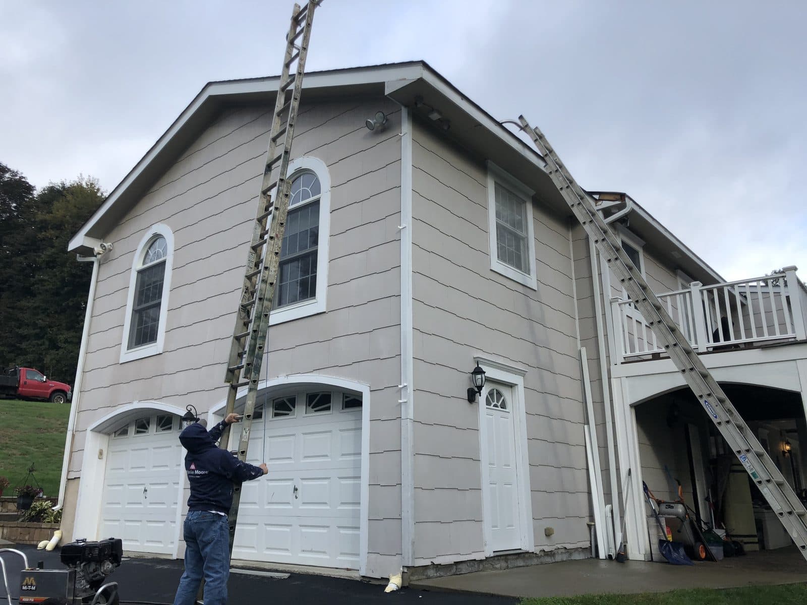 A C&C Fabian craftsman painting a home exterior in Westchester County.