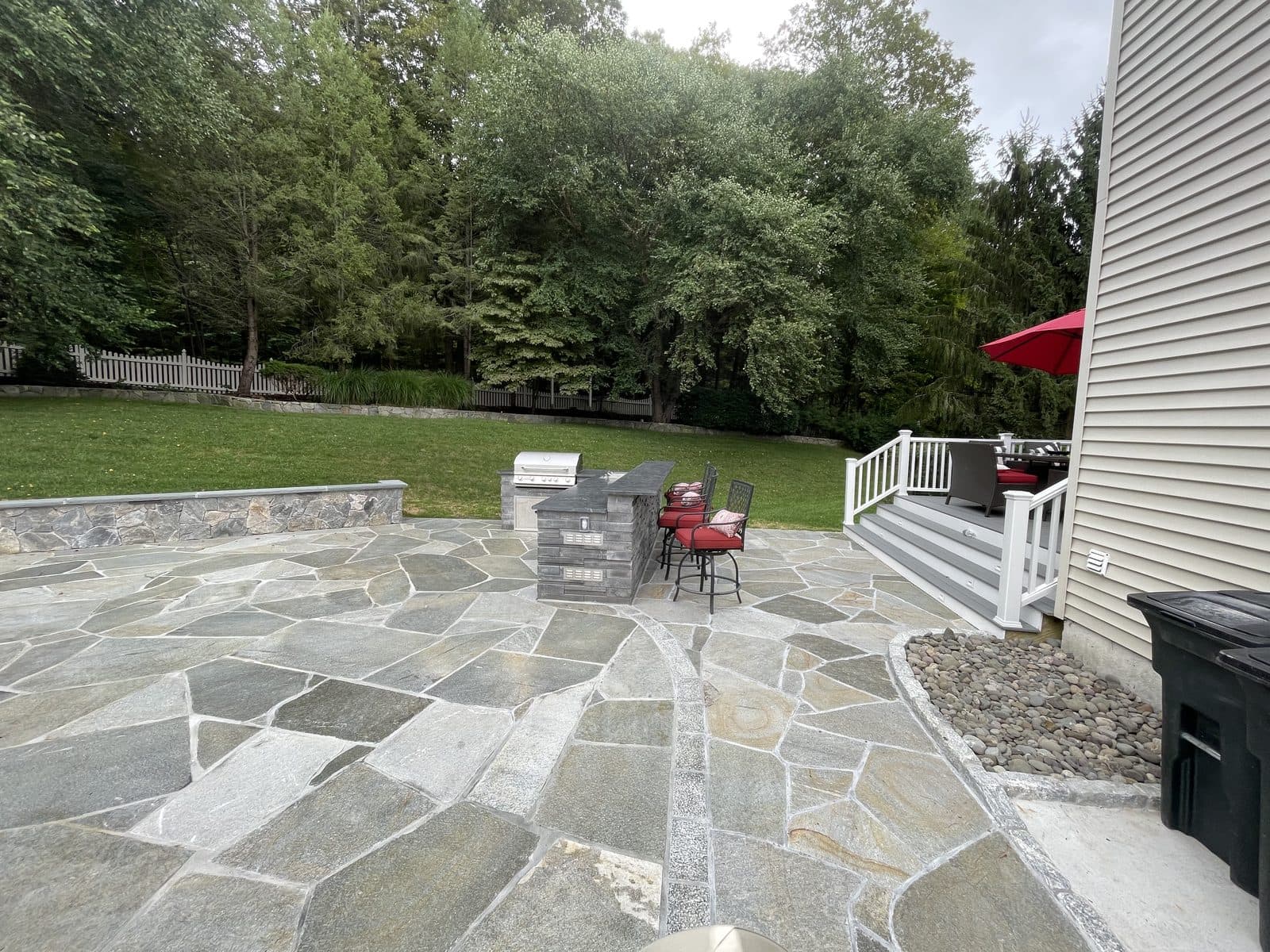 Flagstone patio surrounded by trees