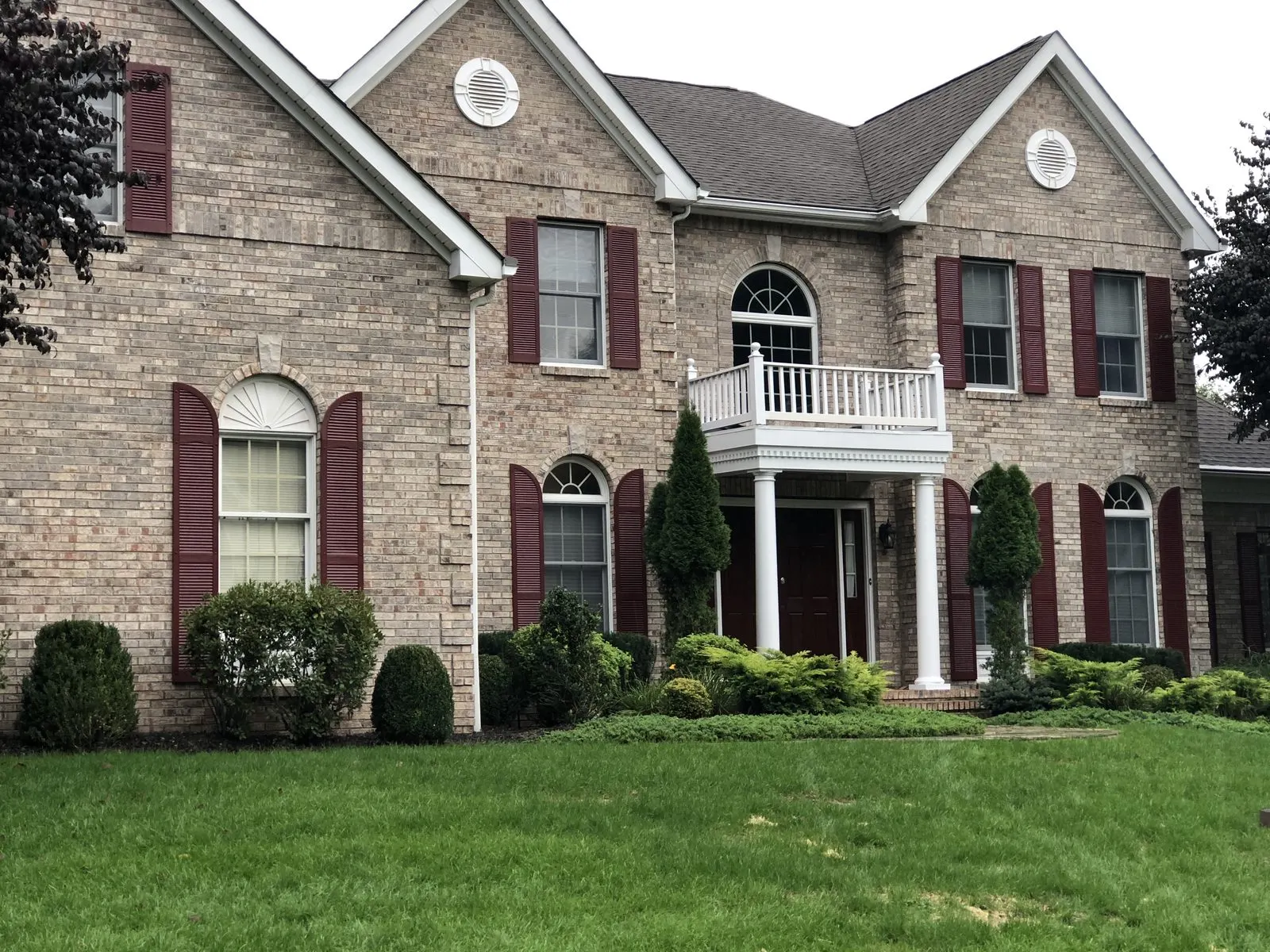 Exterior trim and door painting on a brick colonial in Somers, NY