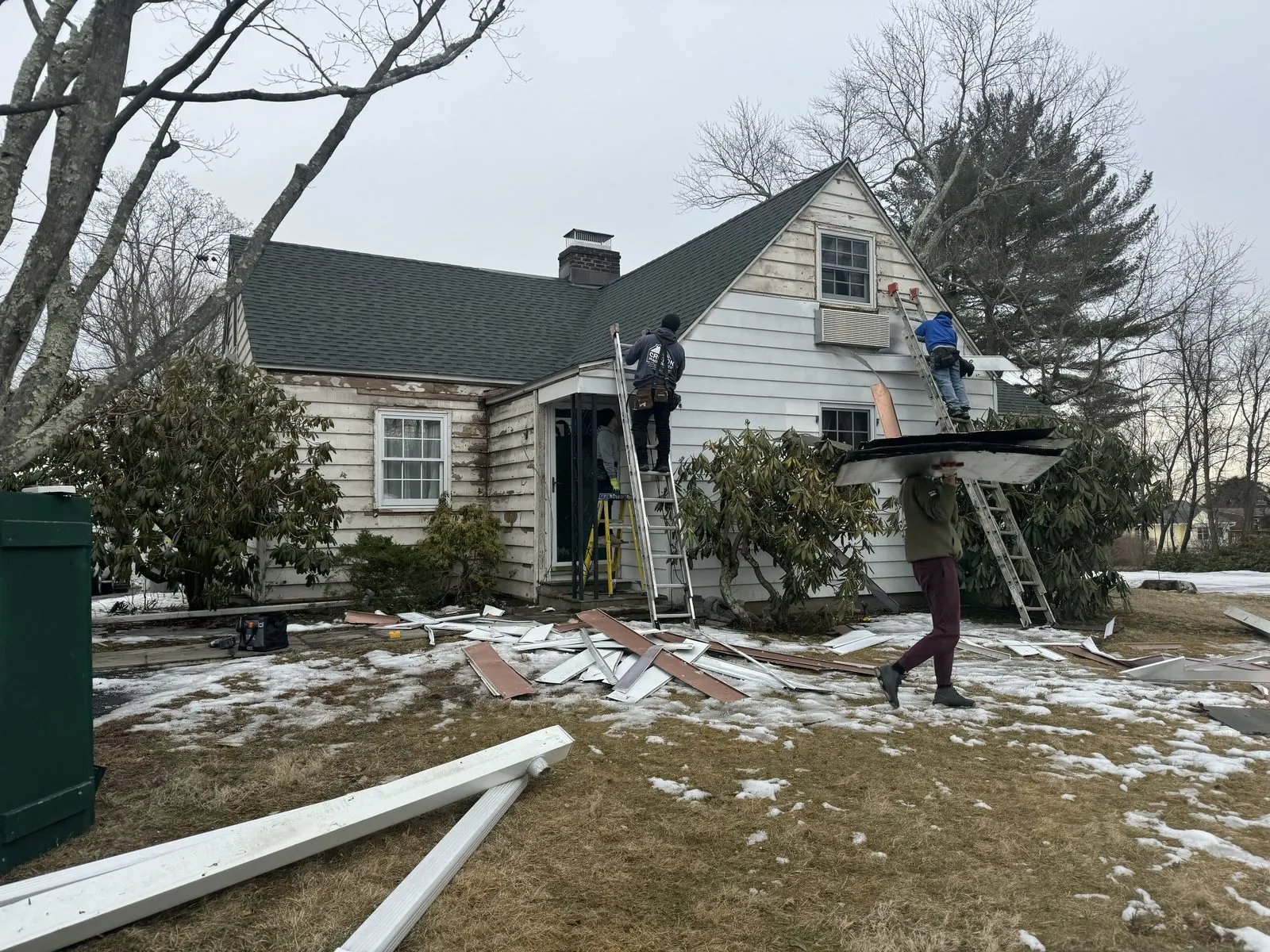 CC Fabian crew working at a home during winter conditions.