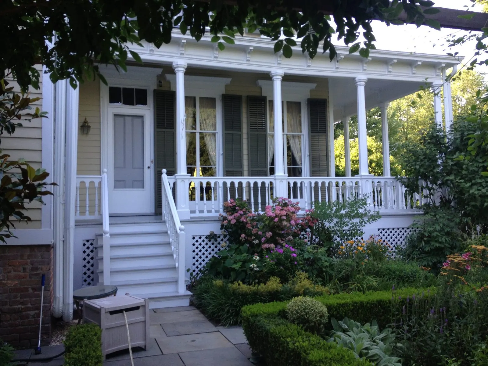 Exterior house painting with a crisp covered porch in Somers, NY