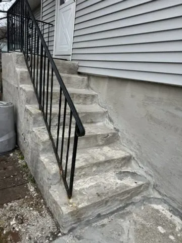 Iron handrail installation on stone steps in Carmel, NY