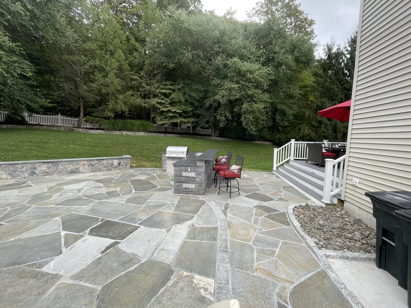 Flagstone patio surrounded by trees