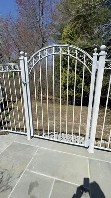 Ornamental garden gate installation in Westchester County, NY