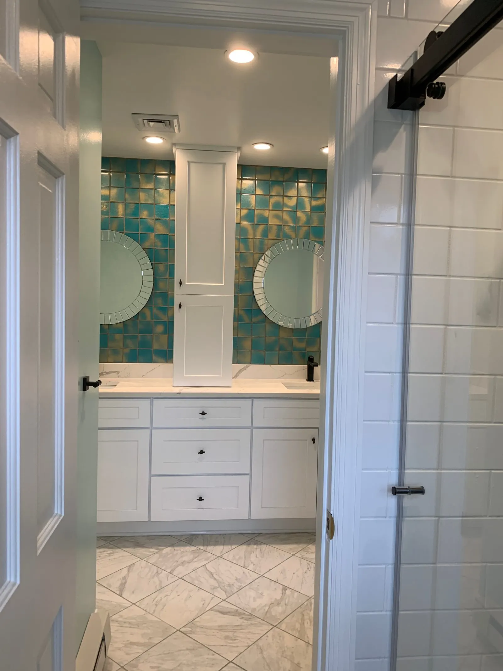 Completed bathroom remodel with marble-look tile in Putnam County, NY