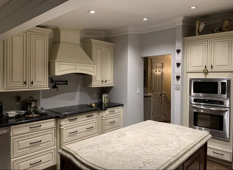 Cream cabinet painting with a double oven in Carmel, NY