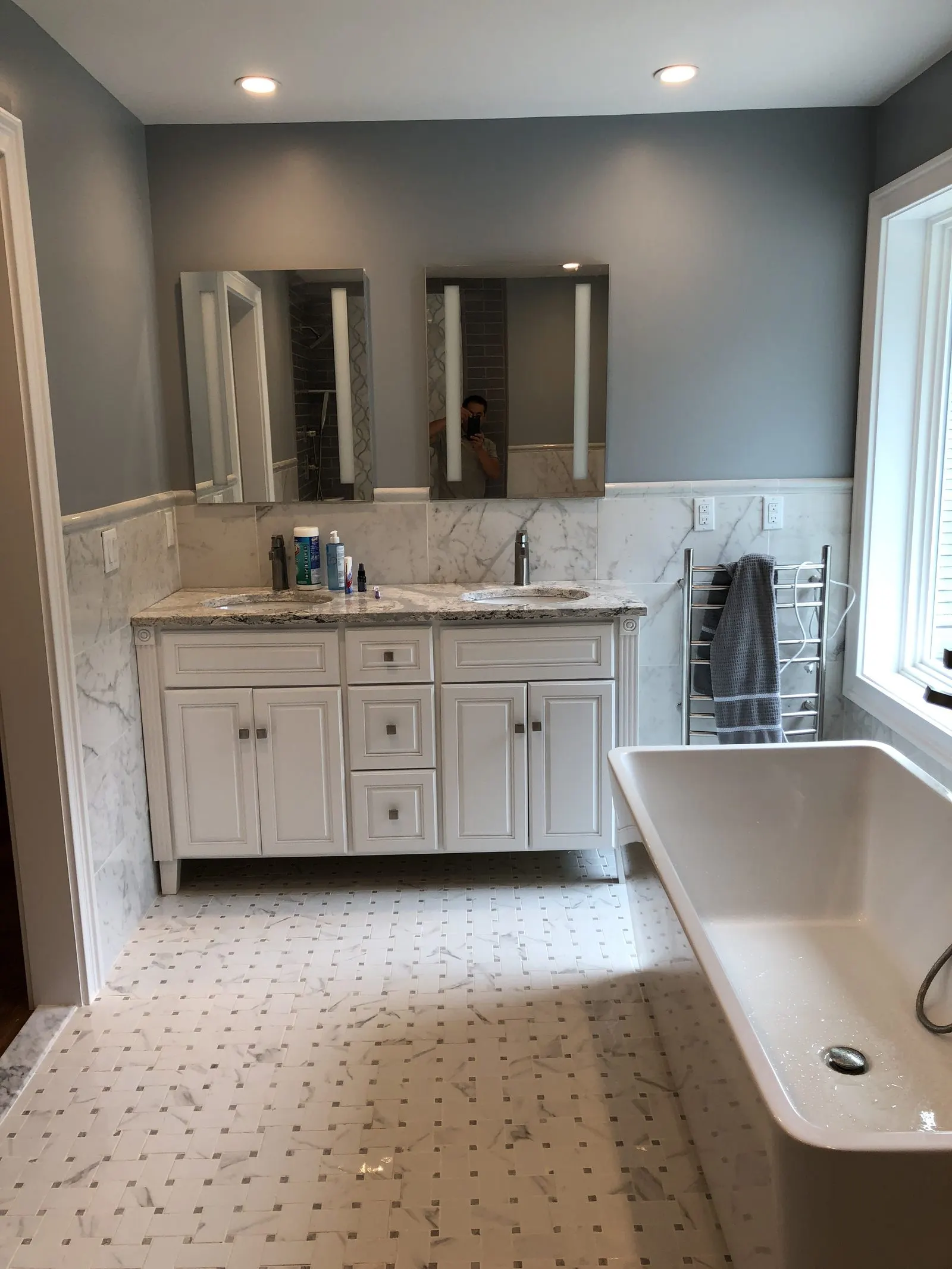 Tiled bathroom remodel with a white vanity in Putnam County, NY