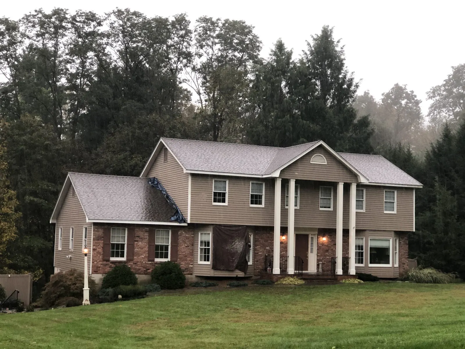 Warm tan exterior repaint on a colonial home in Yorktown, NY