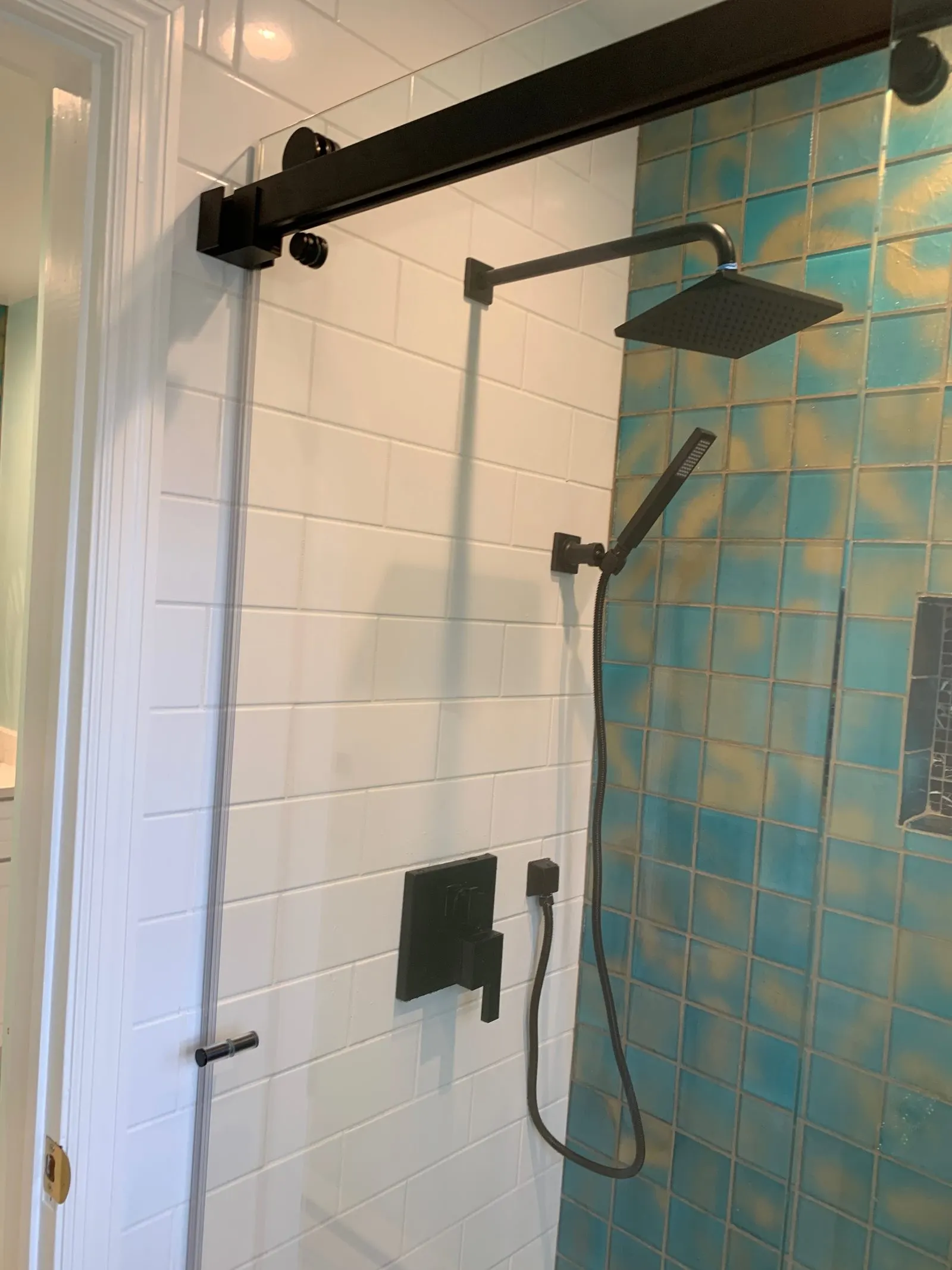 Tiled shower remodel with matte-black fixtures in Carmel, NY