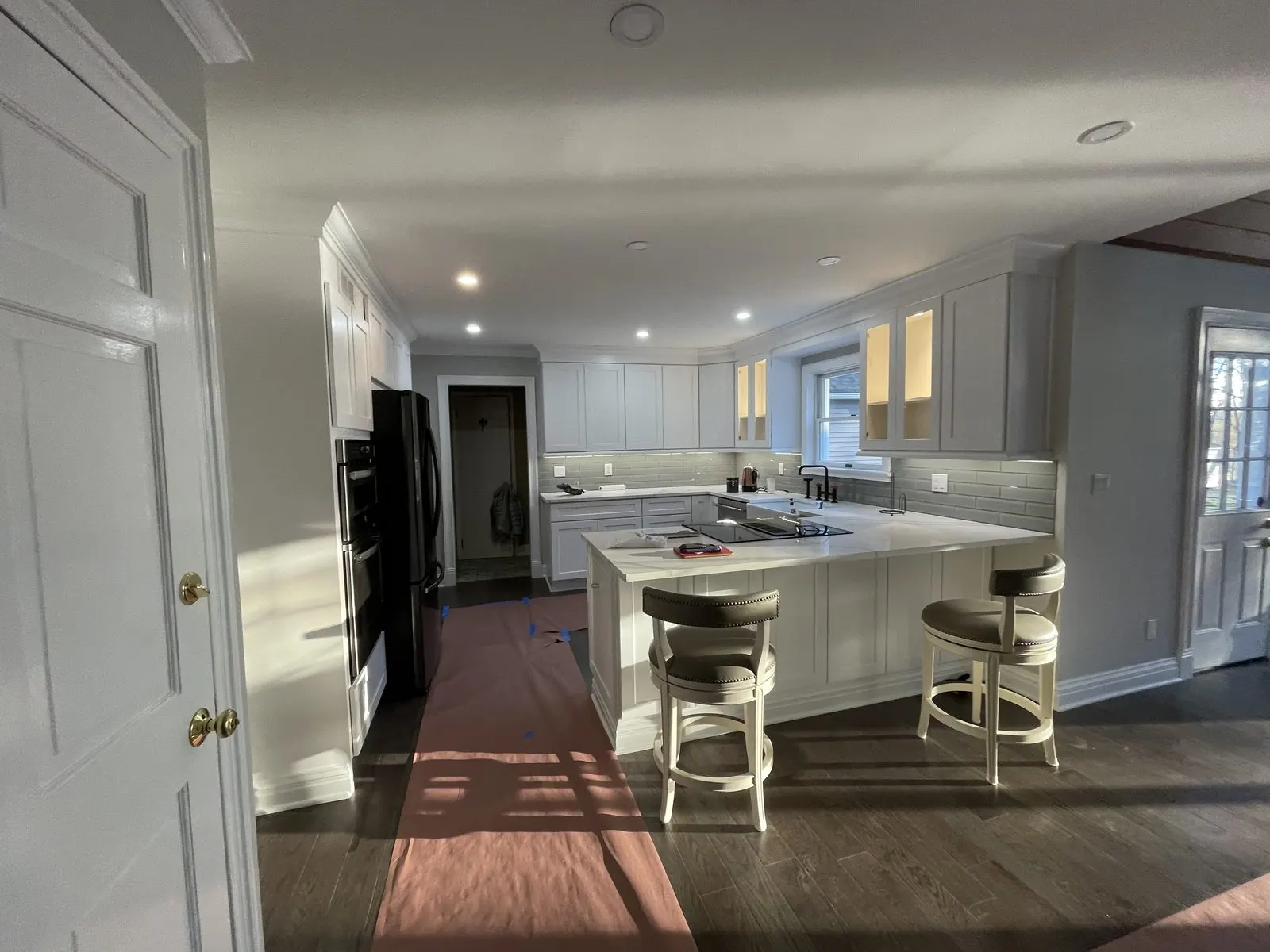 Kitchen cabinet painting with a white island in Westchester County, NY
