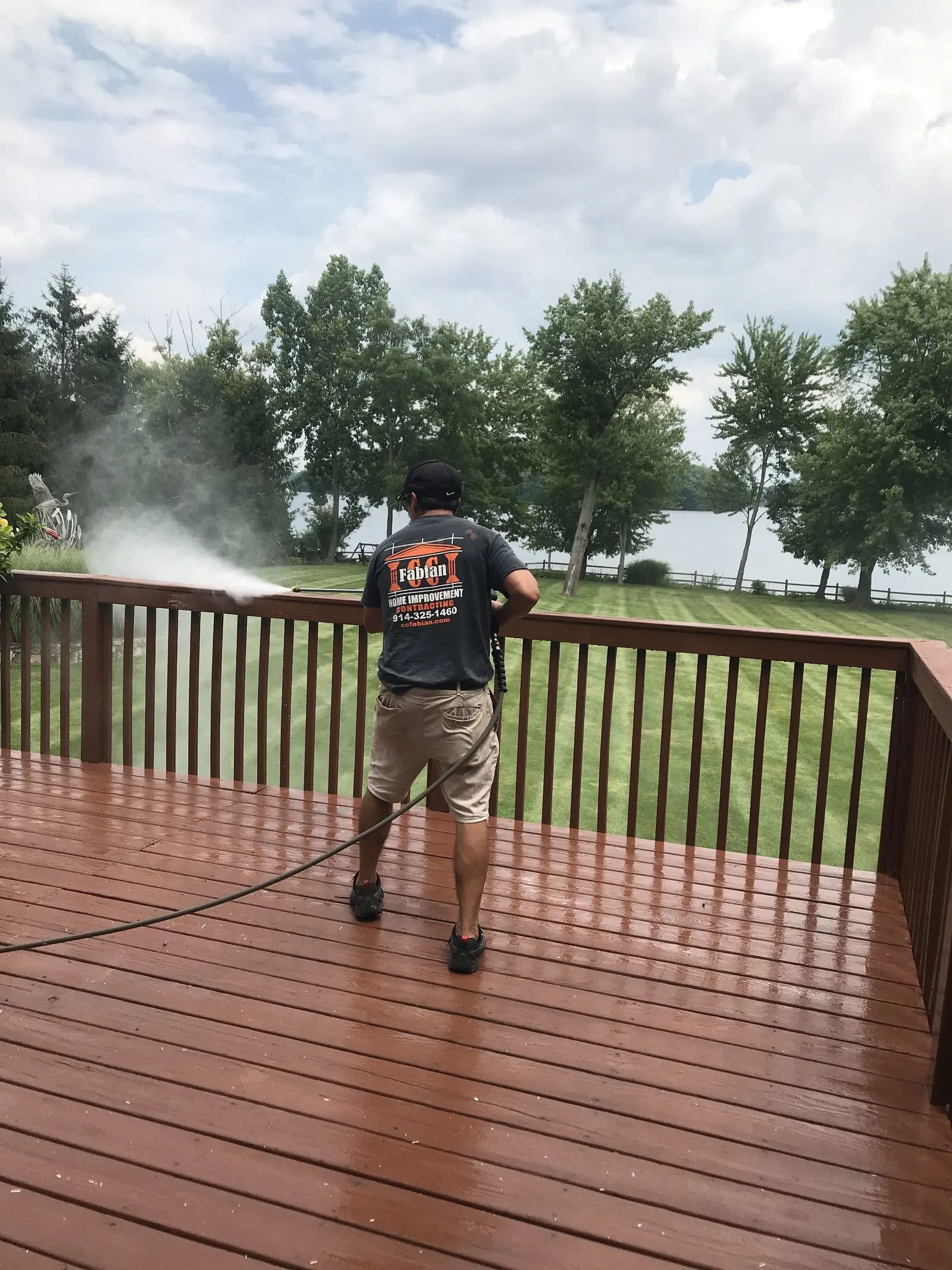 CC Fabian crew staining a wood deck in Westchester County, NY