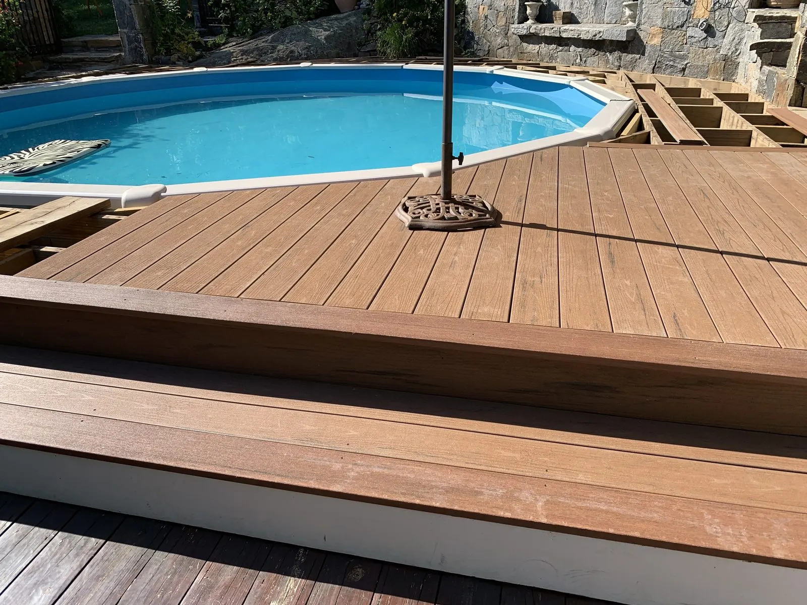 Composite deck installation by a pool in Westchester County, NY