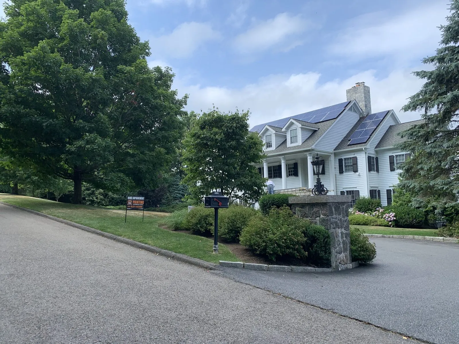 Exterior house painting on a large home in Yorktown, NY