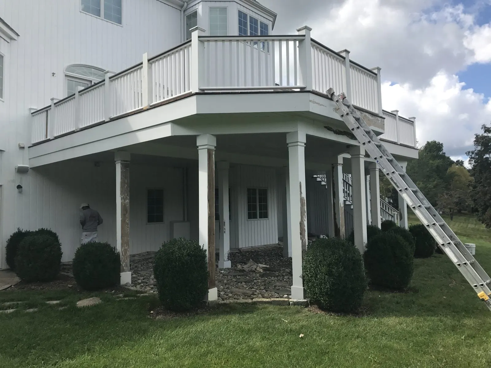 Exterior painting on a columned front porch in Mahopac, NY