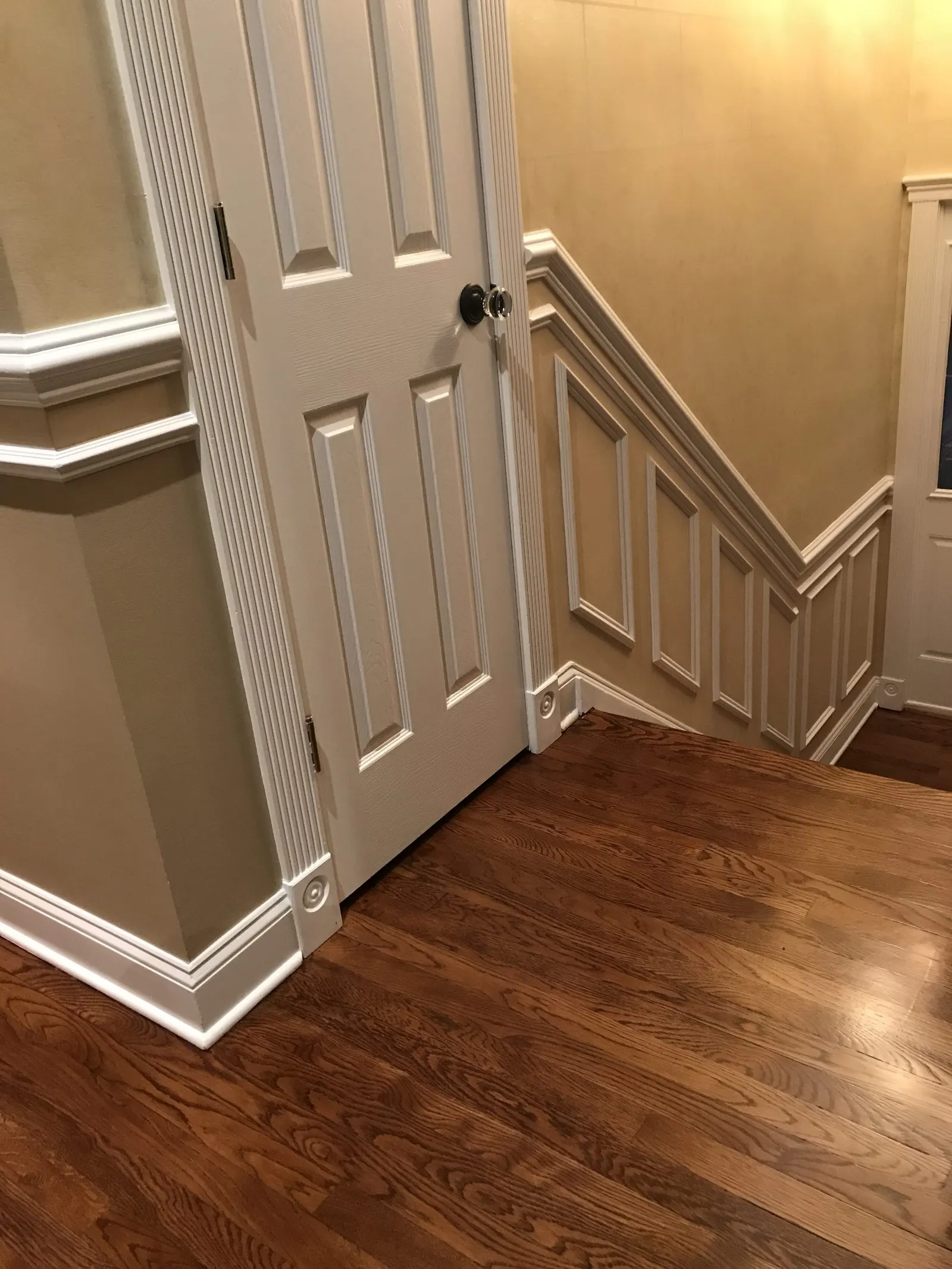 Hardwood floor refinishing with fresh baseboards in Carmel, NY