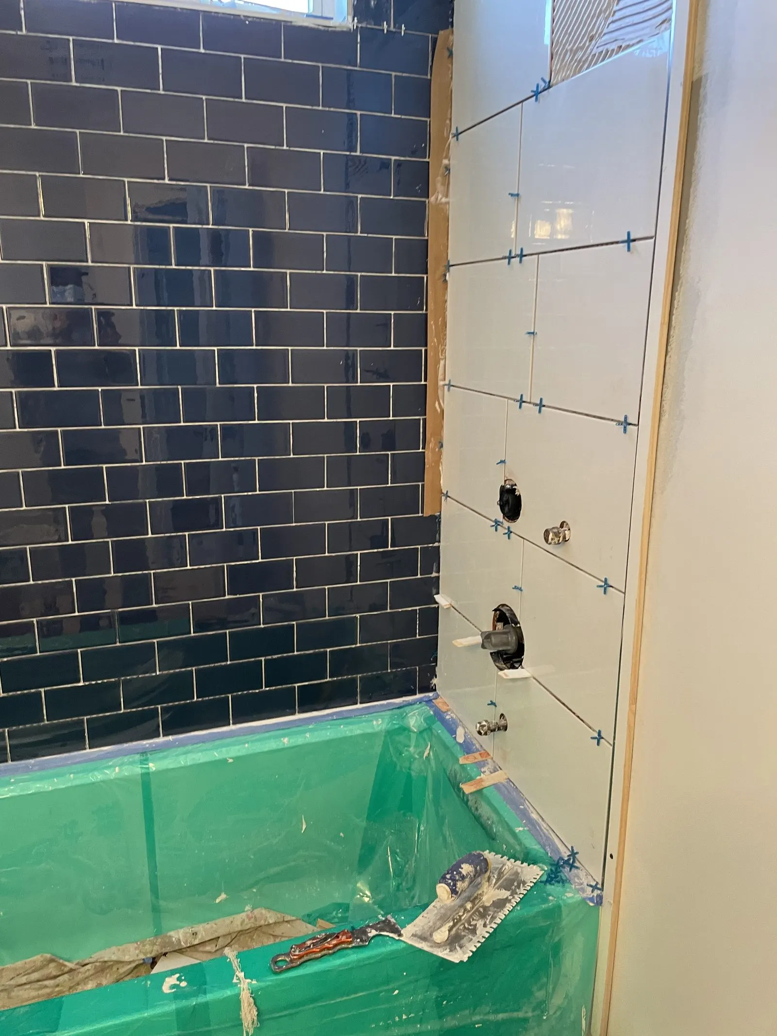 Bathroom remodel in progress, tiling the shower floor in Somers, NY