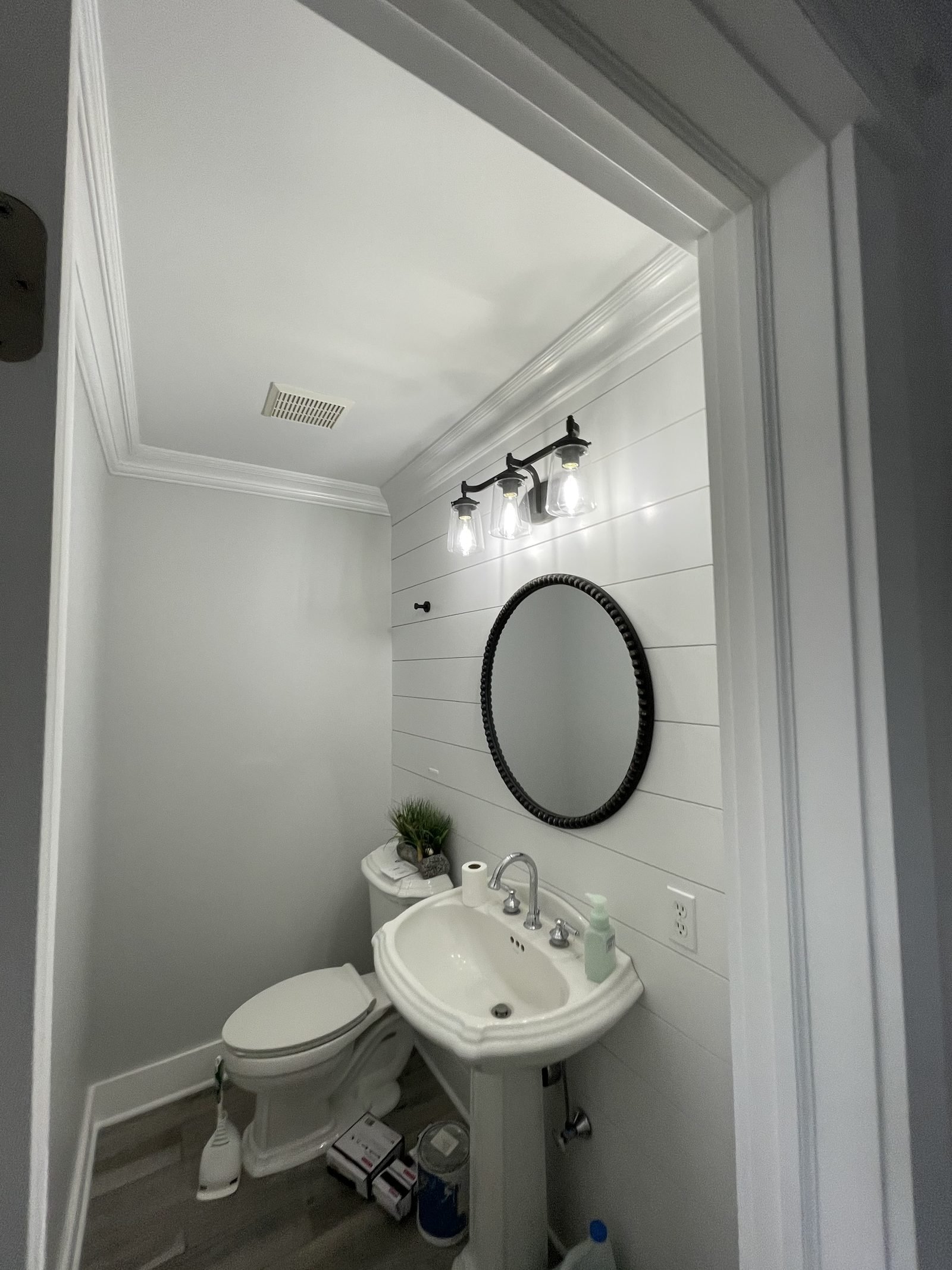 Modern bathroom with round mirror vanity