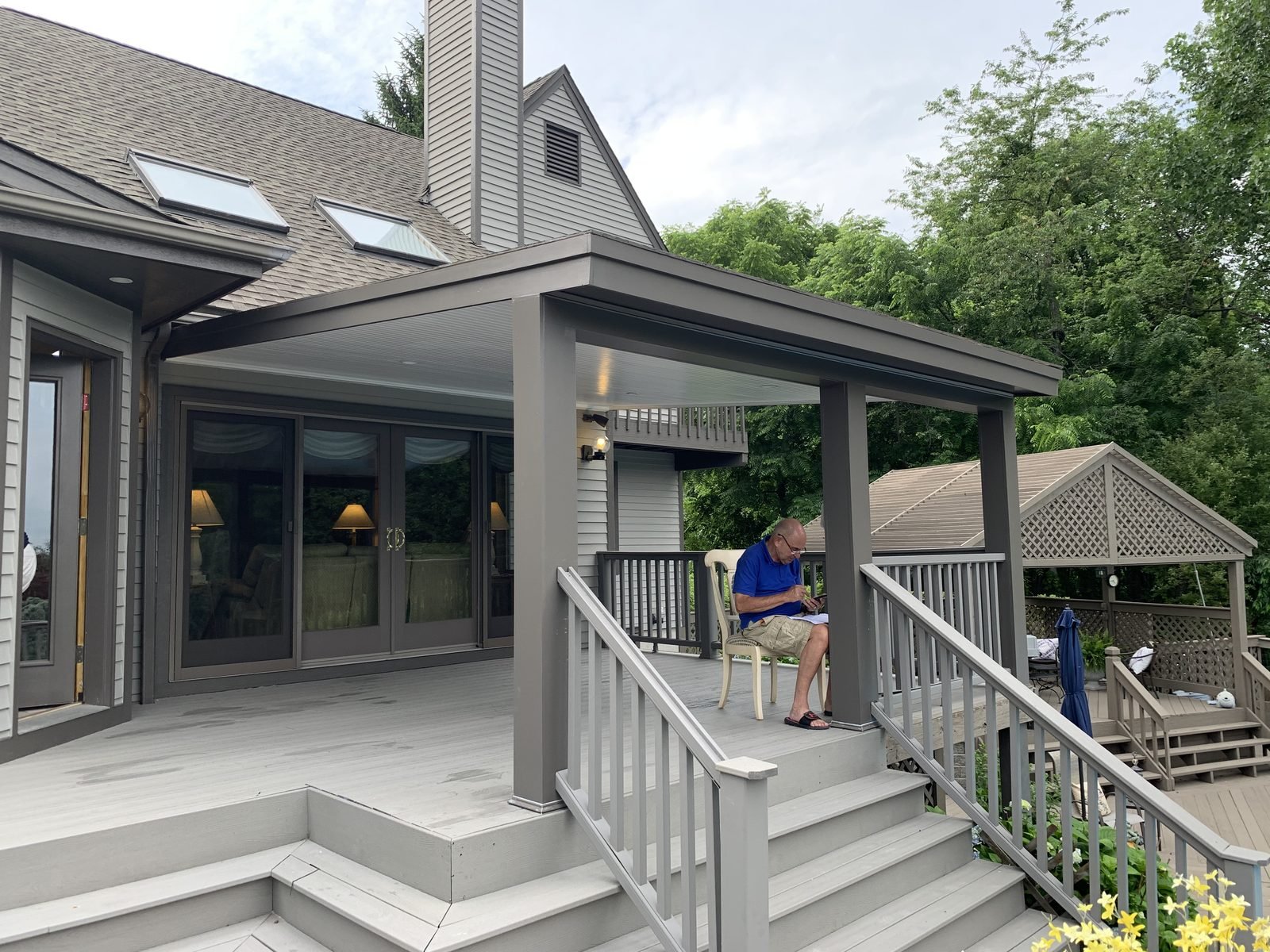 Gray house with covered porch and steps