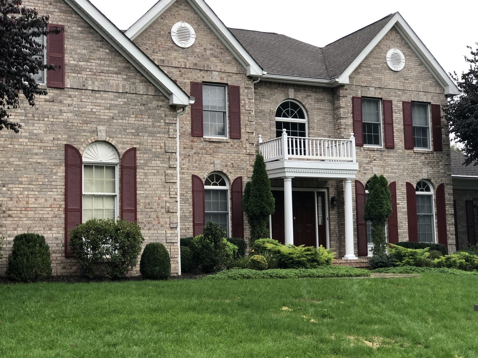 Large brick colonial home exterior