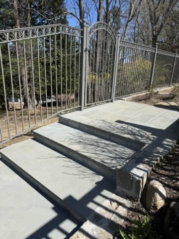 White ornamental double gate and fence