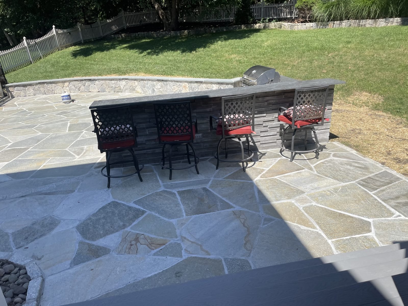 Flagstone patio with built-in bar and seating